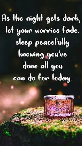 Good night wishes app screenshot with peaceful sleep quote and decorative lantern on wooden surface with bokeh lights