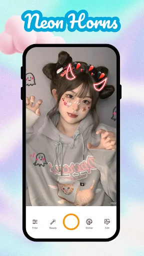 Kawaii camera app with playful devil horns and cute character stickers applied to girl in gray hoodie for photo editing