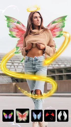 Butterfly wings photo effect overlay on woman in Photo Mirror app with fantasy filter selection toolbar at bottom