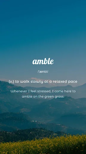Word learning screen showing amble with pronunciation definition and example sentence displayed over scenic mountain lake landscape background